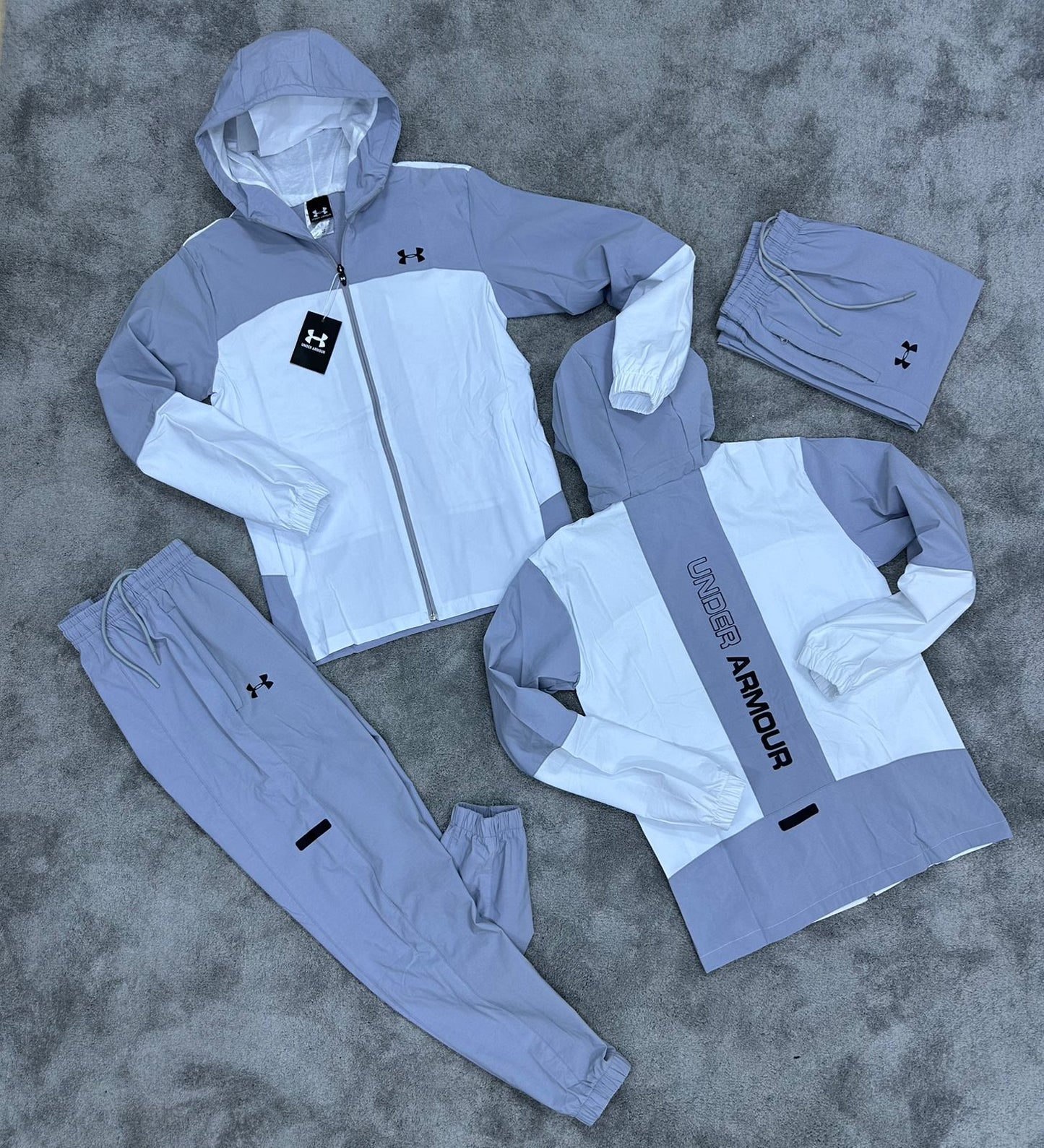 UNDER ARMOUR • GRIS/BLANCO